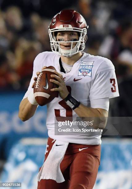 Washington State Cougars quarterback Tyler Hilinski back to pass in the fourth quarter of the Holiday Bowl played against the Michigan State...