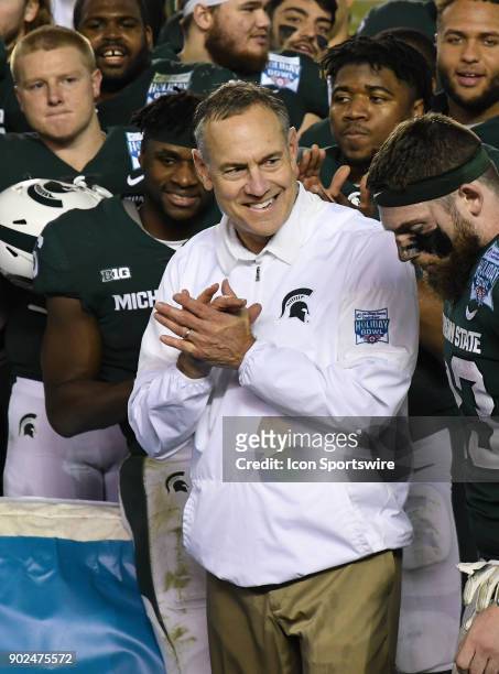 Michigan State Spartans head coach Mark Dantonio on the field before receiving the SDCCU Holiday Bowl Trophy after the Spartans defeated the...