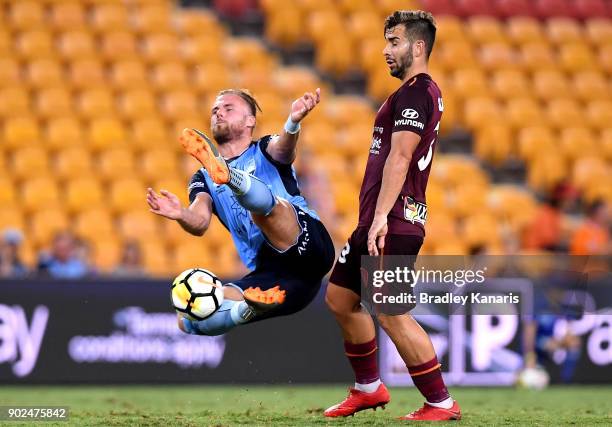 Jordy Buijs of Sydney and Petros Skapetis of the Roar compete for the ball during the round 15 A-League match between the Brisbane Roar and Sydney FC...