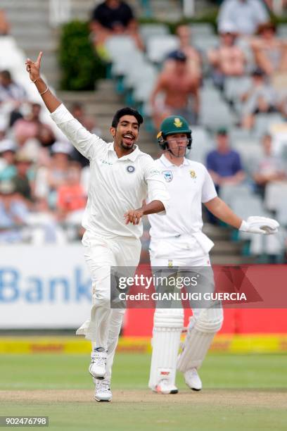 Indian bowler Jasprit Bumrah celebrates the dismissal of South African batsman Quinton de Kock during the fourth day of the first Test cricket match...