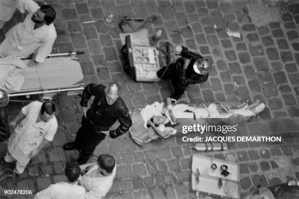 View of firemen and a rescuers after the French-Jewish delicatessen restaurant Jo Goldenberg was attacked on August 9, 1982 in the rue des Rosiers in...