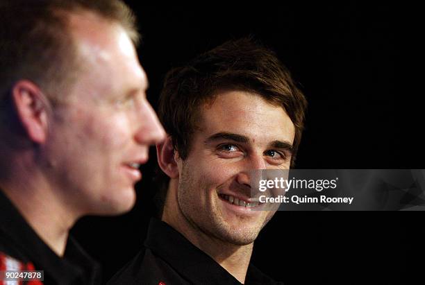 Essendon Bombers coach Matthew Knights and Jobe Watson of the Essendon Bombers address the audience during an AFL Final Series media Conference at...