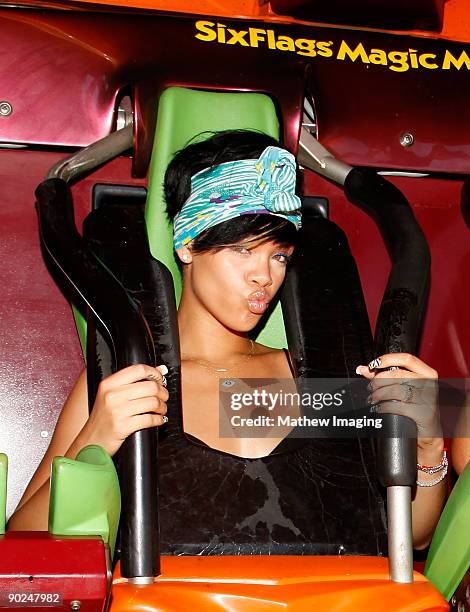 Singer Rihanna enjoys the Tatsu rollercoaster on a visit to Six Flags Magic Mountain on August 31, 2009 in Valencia, California.