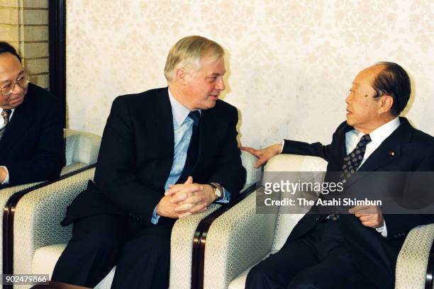Hong Kong Governor Chris Patten talks to Japanese Prime Minister Kiichi Miyazawa during their meeting at the prime minister's official residence on...
