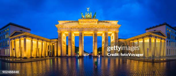 berlin brandenburg gate iconic landmark panorama illuminated at dusk germany - brandenburger tor stock pictures, royalty-free photos & images