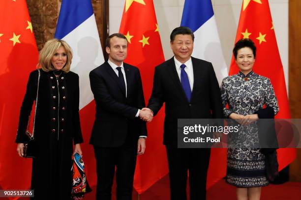 French President Emmanuel Macron, second from left, and wife Brigitte Macron, left, meet with Chinese President Xi Jinping, second from right, and...