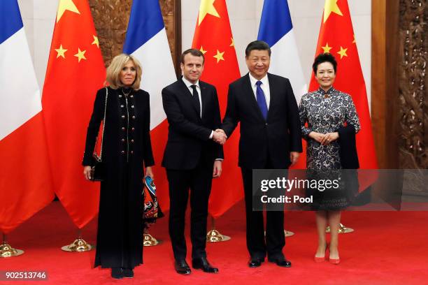 French President Emmanuel Macron, second from left, and wife Brigitte Macron, left, meet with Chinese President Xi Jinping, second from right, and...