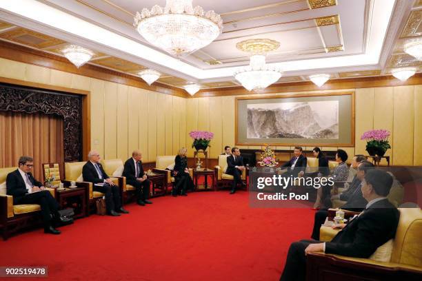 French President Emmanuel Macron and Brigitte Macron meet with Chinese President Xi Jinping and wife Peng Liyuan during a meeting at the Diaoyutai...