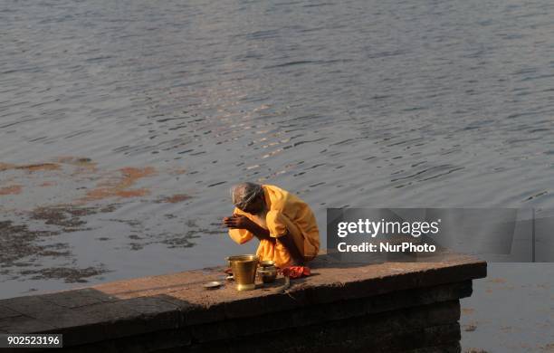 Local priest offer Tarpan rituals in todays cold morning on the banks of holy pond Bindu Sagar in the eastern Indian state Odisha's capital city...