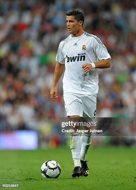 Cristiano Ronaldo of Real Madrid runs with the ball during the La Liga match between Real Madrid and Deportivo La Coruna at the Estadio Santiago...