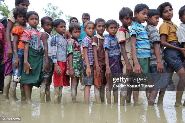 Rohingya Refugees are waiting for relief near the Thengkhali makeshift camp in Coxs bazar, Bangladesh. Thousands of Rohingyas still crossing the...