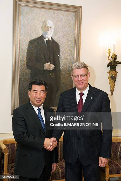 China's Vice Prime Minister Hui Liangyu shakes hands with Latvian President Valdis Zatlers ahead of their meeting in Riga on September 1, 2009. Hui...