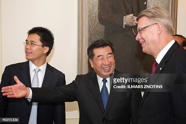 China's Vice Prime Minister Hui Liangyu and Latvian President Valdis Zatlers arrive for a meeting in Riga on September 1, 2009. Hui Liangyu is...