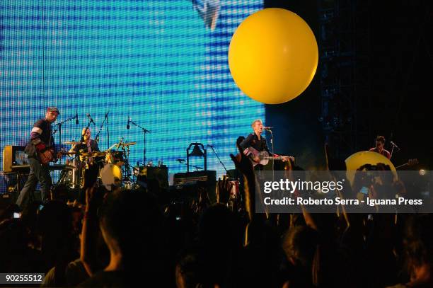 Jonny Buckland - Will Champion - Chris Martin - Guy Berryman of Coldplay performs at the Friuli stadium on August 31, 2009 in Udine, Italy.