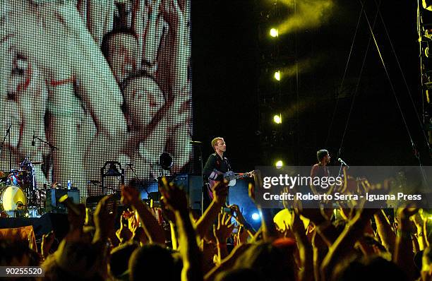 Chris Martin and Guy Berryman of Coldplay performs at the Friuli stadium on August 31, 2009 in Udine, Italy.