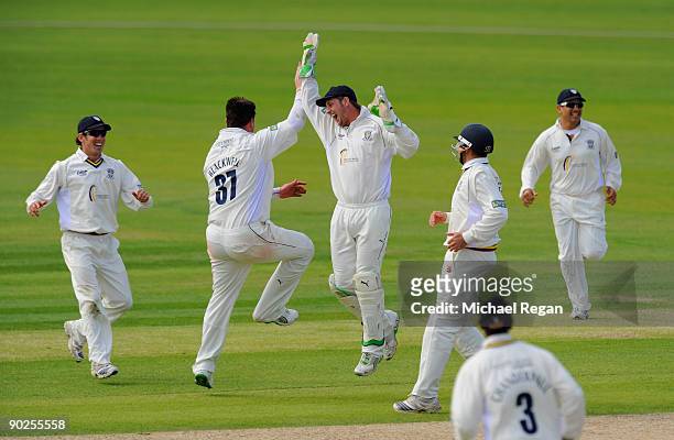 Ian Blackwell celebrates with Phil Mustard after taking the wicket of Ben Phillips of Somerset LBW during the LV County Championship match between...