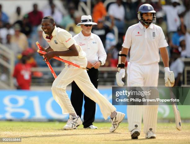 Sulieman Benn of West Indies grabs two stumps after taking the final England wicket to win the 1st Test match between West Indies and England at...