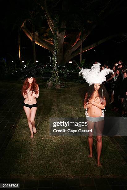 Models wear designs by "Love Chile"during the "Night of the Butterfly" charity fashion parade and party hosted by Faye Delanty's Love Chile brand in...