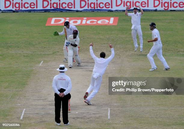 England bowler Graeme Swann celebrates after taking the wicket of West Indies batsman Devon Smith during the 3rd Test match between West Indies and...