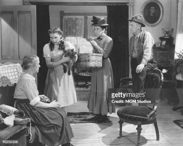 From left to right, Clara Blandick, Judy Garland, Margaret Hamilton and Charley Grapewin star in the MGM film 'The Wizard of Oz', 1939. In this...