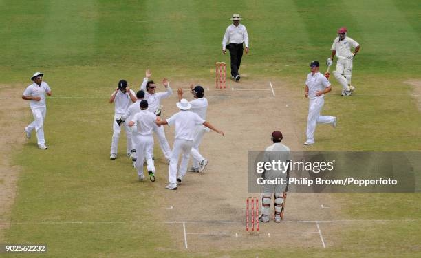 England bowler Graeme Swann celebrates with team mates after taking the wicket of West Indies batsman Ryan Hinds during the 4th Test match between...