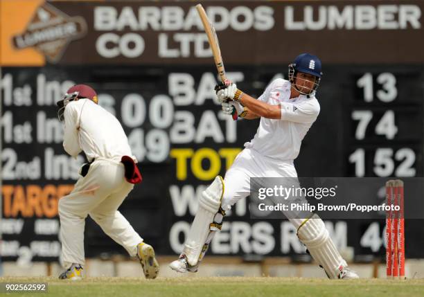 England batsman Alastair Cook hits out during his innings of 139 not out as West Indies fielder Brendan Nash takes evasive action during the 4th Test...