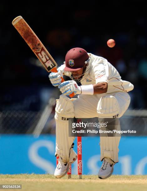 West Indies batsman Lendl Simmons ducks under a bouncer during the 5th Test match between West Indies and England at Queen's Park Oval, Port of...