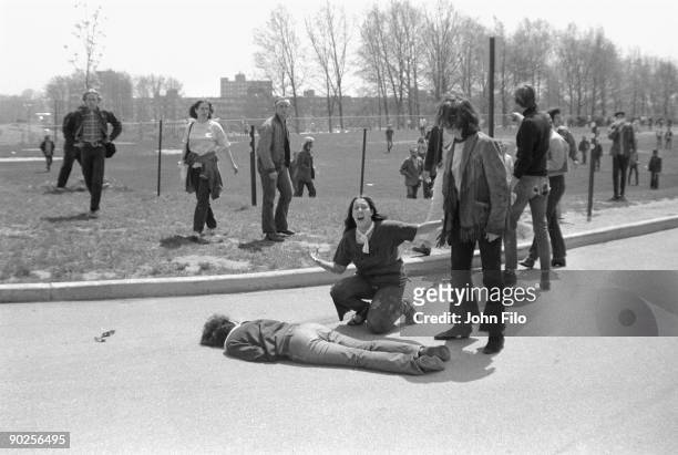 Teenager Mary Ann Vecchio screams as she kneels over the body of Kent State University student Jeffrey Miller who had been shot during an anti-war...