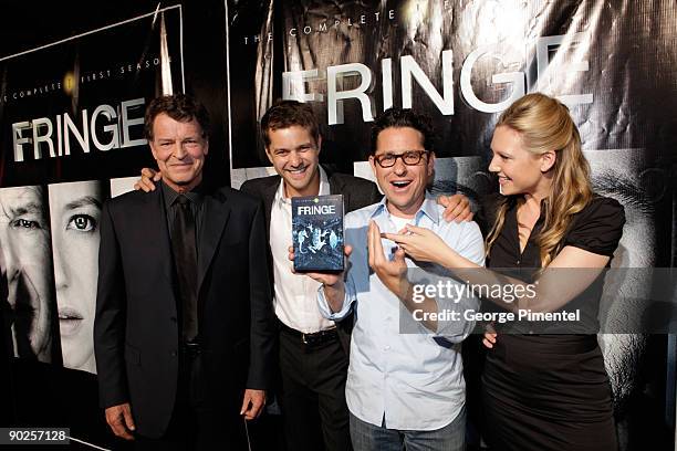 Actor John Noble, actor Joshua Jackson, executive producer J.J. Abrams and actress Anna Torv arrive at the DVD Launch for Season 1 of "Fringe" on...