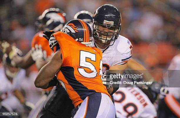 Offensive tackle Kevin Shaffer of the Chicago Bears blocks against the rush of linebacker Robert Ayers of the Denver Broncos during preseason NFL...