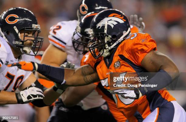 Offensive tackle Kevin Shaffer of the Chicago Bears blocks against the rush of linebacker Robert Ayers of the Denver Broncos during preseason NFL...