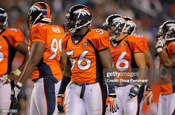 Linebacker Robert Ayers of the Denver Broncos awaits action against the Chicago Bears during preseason NFL action at INVESCO Field at Mile High on...