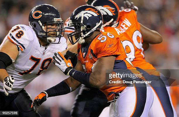 Offensive tackle Kevin Shaffer of the Chicago Bears blocks against the rush of linebacker Robert Ayers of the Denver Broncos during preseason NFL...