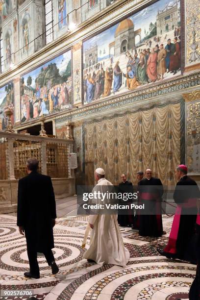 Pope Francis leaves after he poses with the accredited ambassadors to the Holy See at the Sistine Chapel 'Cappella Sistina' on January 8, 2018 in...