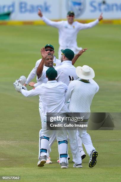 Vernon Philander of South Africa and team mates celebrate the wicket of Virat Kohli of India during day 4 of the 1st Sunfoil Test match between South...