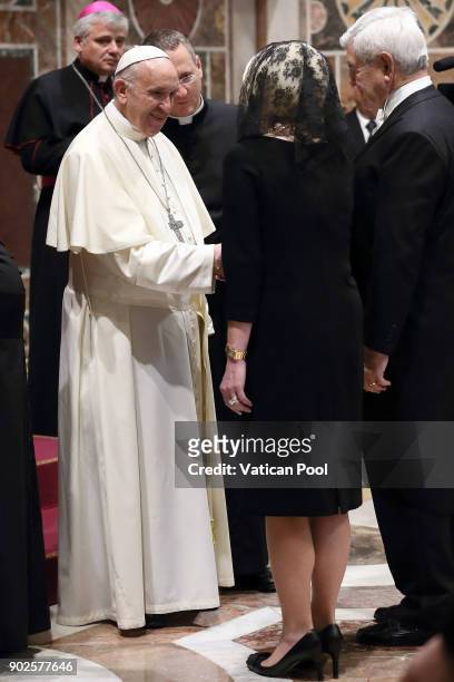 Pope Francis greets U.S. Ambassador to the Holy See Callista Gingrich and her husband Newt Gingrich during the State Of The World Address to...
