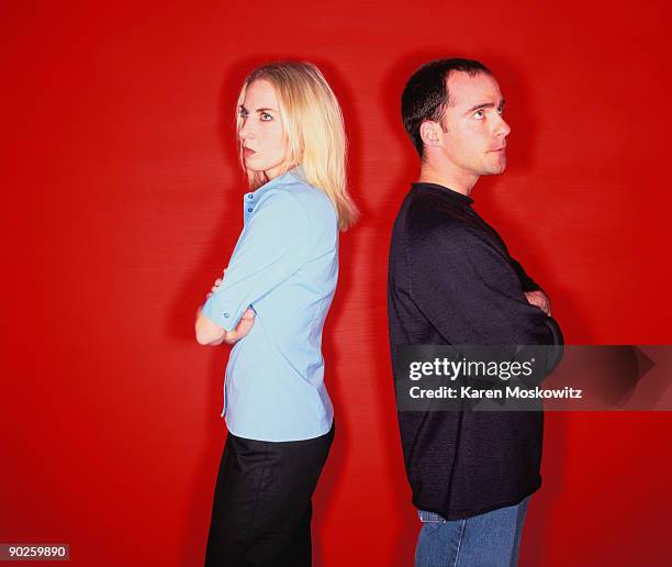 angry couple - back to back stock pictures, royalty-free photos & images