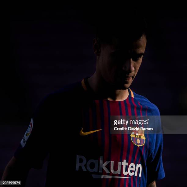 New FC Barcelona signing Philippe Coutinho looks on as he is unveiled at Nou Camp on January 8, 2018 in Barcelona, Spain. The Brazilian player signed...