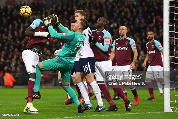 Adrian and Cheikhou Kouyate of West Ham United get in a tangle during the Premier League match between Tottenham Hotspur and West Ham United at...