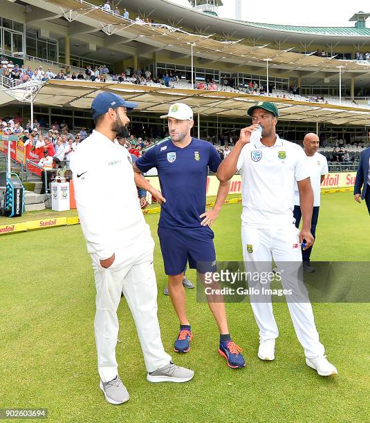 Virat Kohli of India, Faf du Plessis of South Africa and Vernon Philander of South Africa chats after day 4 of the 1st Sunfoil Test match between...