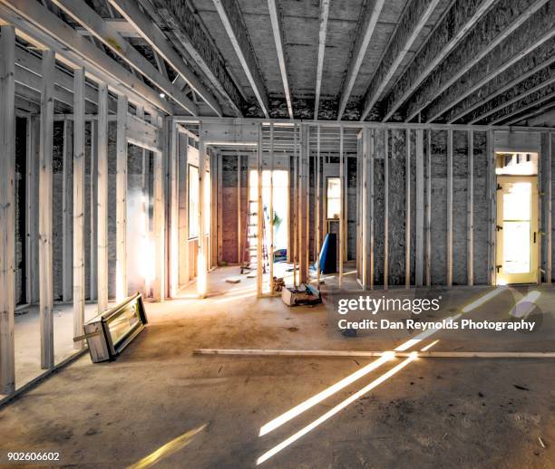 building frame at construction site w/ worker - doorway stock pictures, royalty-free photos & images