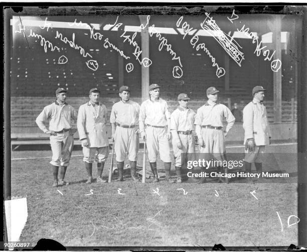 Portrait of several members of the Pittsburgh Pirates baseball team as they pose on the field at West Side Grounds, Chicago, Illinois, 1909. They...