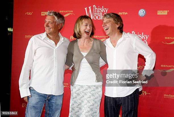 Actor Henry Huebchen, actress Corinna Harfouch and director Andreas Dresen attend the premiere of 'Whisky mit Wodka' at cinema International on...