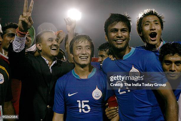 President Praful Patel poses with the jubilant Indian team players Gouramangi Moirangthem Singh, Baichung Bhutia, Abhishek Yadav and Syed Rahim Nabi...