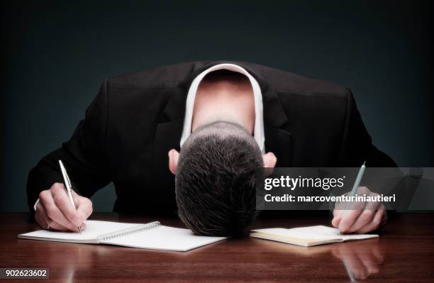 overworked man collapses while writing - defeat funny stock pictures, royalty-free photos & images