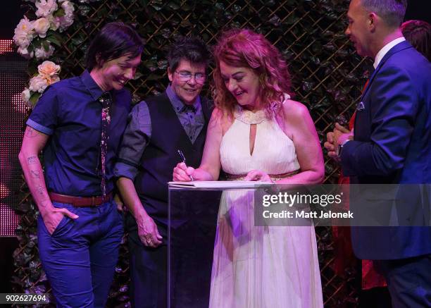 Gillian Brady and Lisa Goldsmith sign their marriage certificate at The Court on January 9, 2018 in Perth, Australia. Couples across Australia wed in...