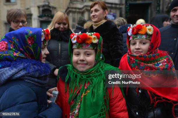 Young girls dressed in a traditional Ukrainian folk costiums awaiting for the Christmas Stars Parade that take place in Lviv on the second day of...