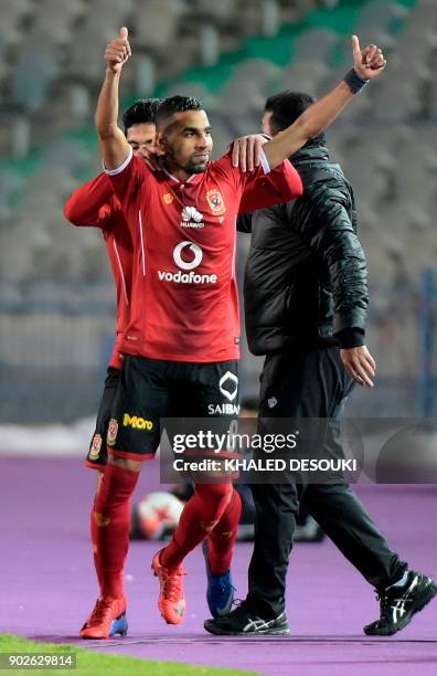 Egypts al-Ahly player Momen Zakaria celebrates with his teammates after scoring a goal during the Egyptian Premier League football match between...