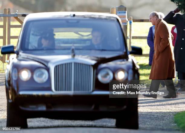 Prince Philip, Duke of Edinburgh departs on foot as Queen Elizabeth II is driven by car after attending Sunday service at St Mary Magdalene Church,...