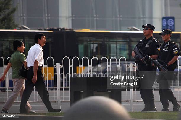 Armed policemen patrol on September 1, 2009 in Beijing, China. Chinese official media reported Tuesday that Beijing has begun raising its security...